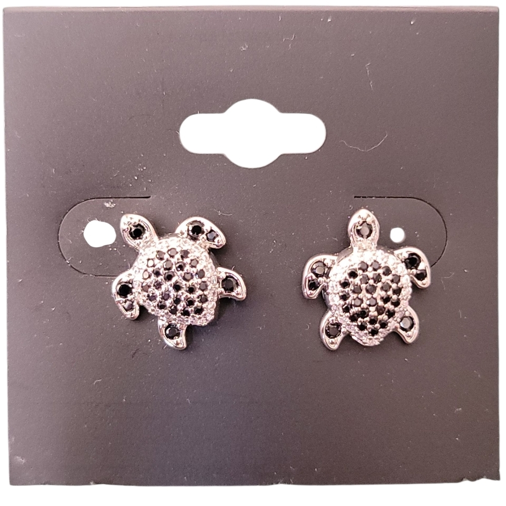 silver-colored sea turtle stud earrings with black crystals